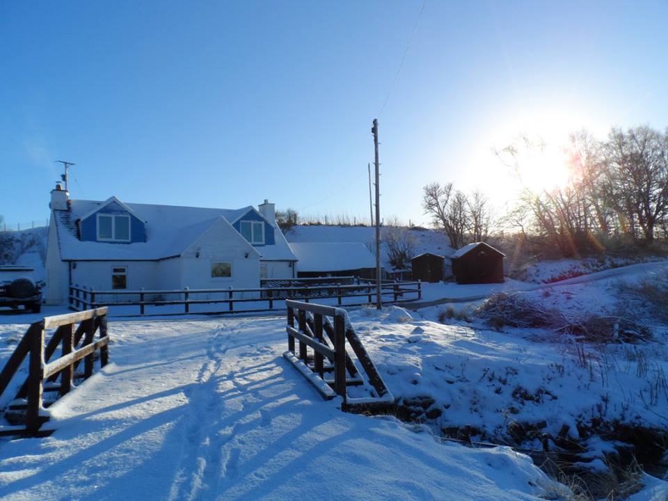 Exterior view of the cottage in snow