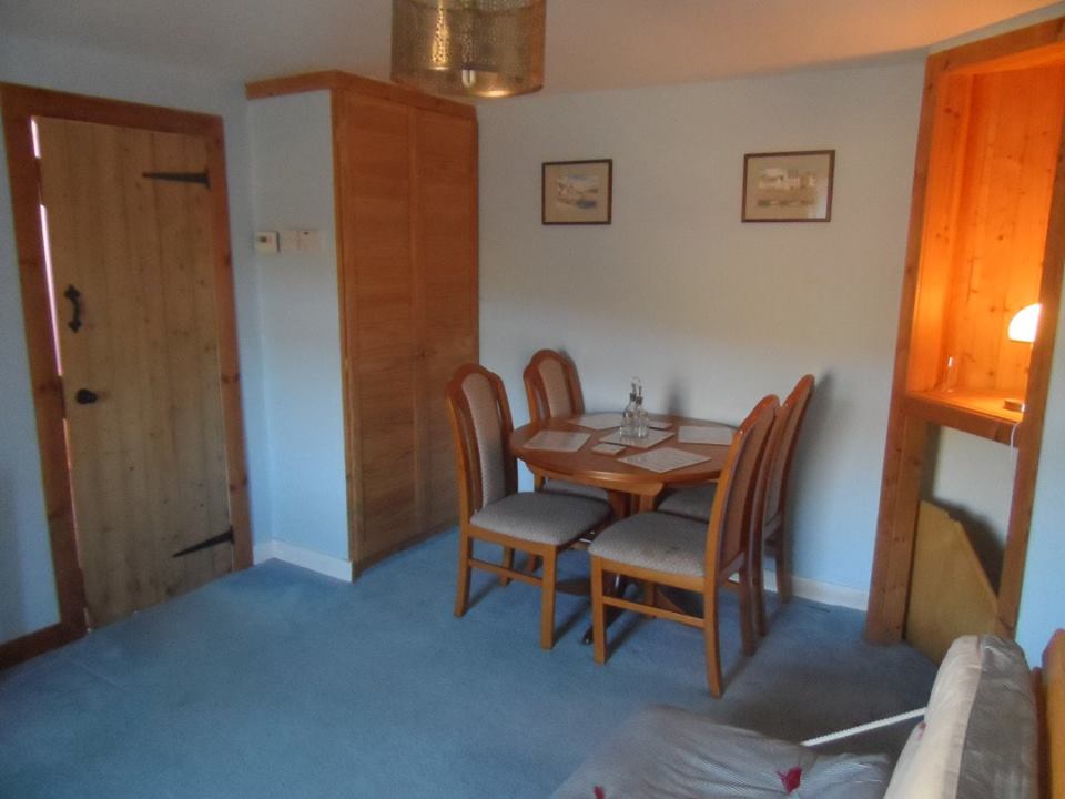 The dining room with table and chairs